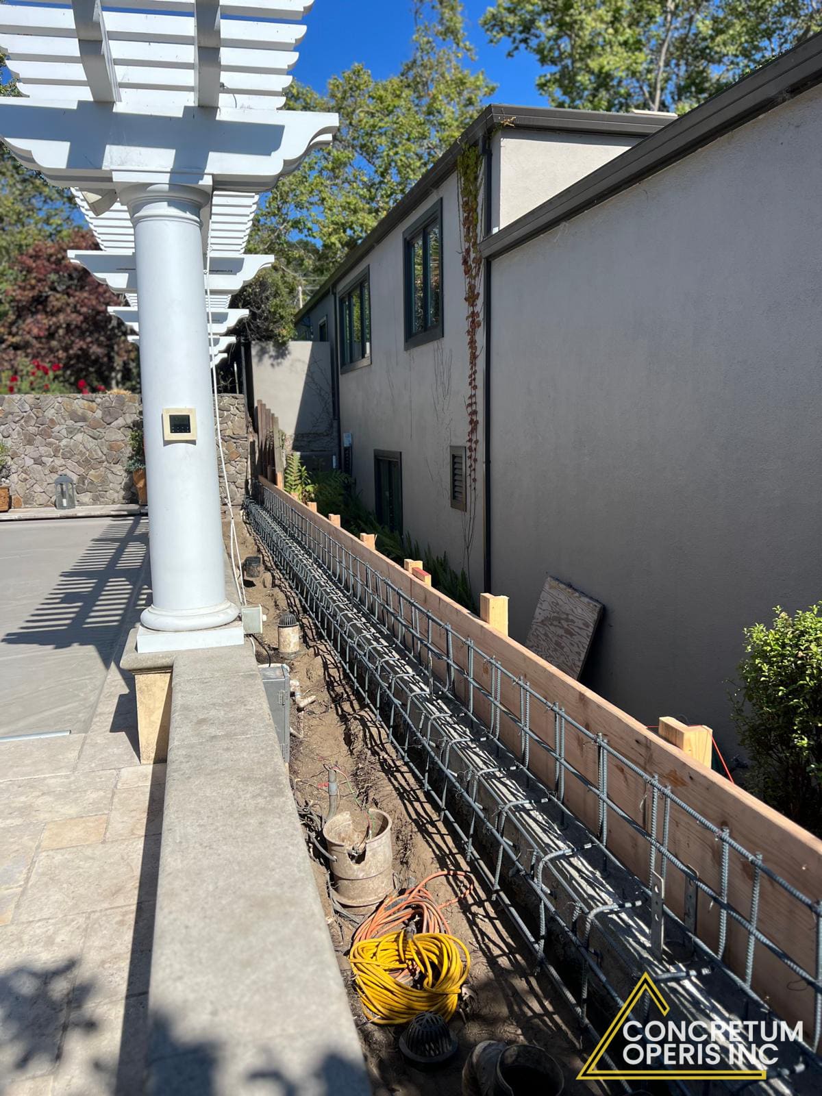 Concrete wall formwork braced and ready for a pour in a Richmond, CA backyard