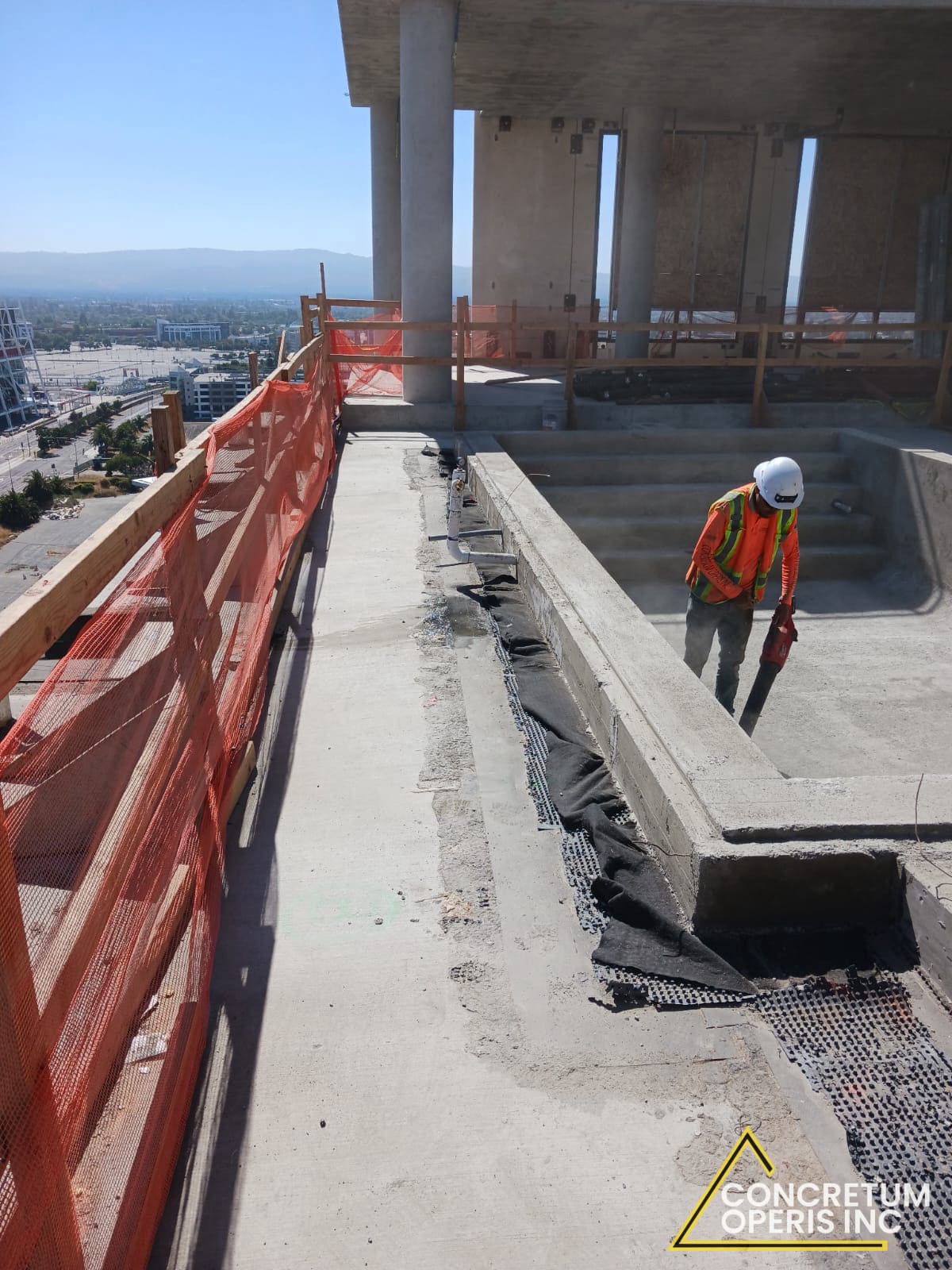 Concretum Operis crew finishing a concrete rooftop terrace pour in Santa Clara, CA