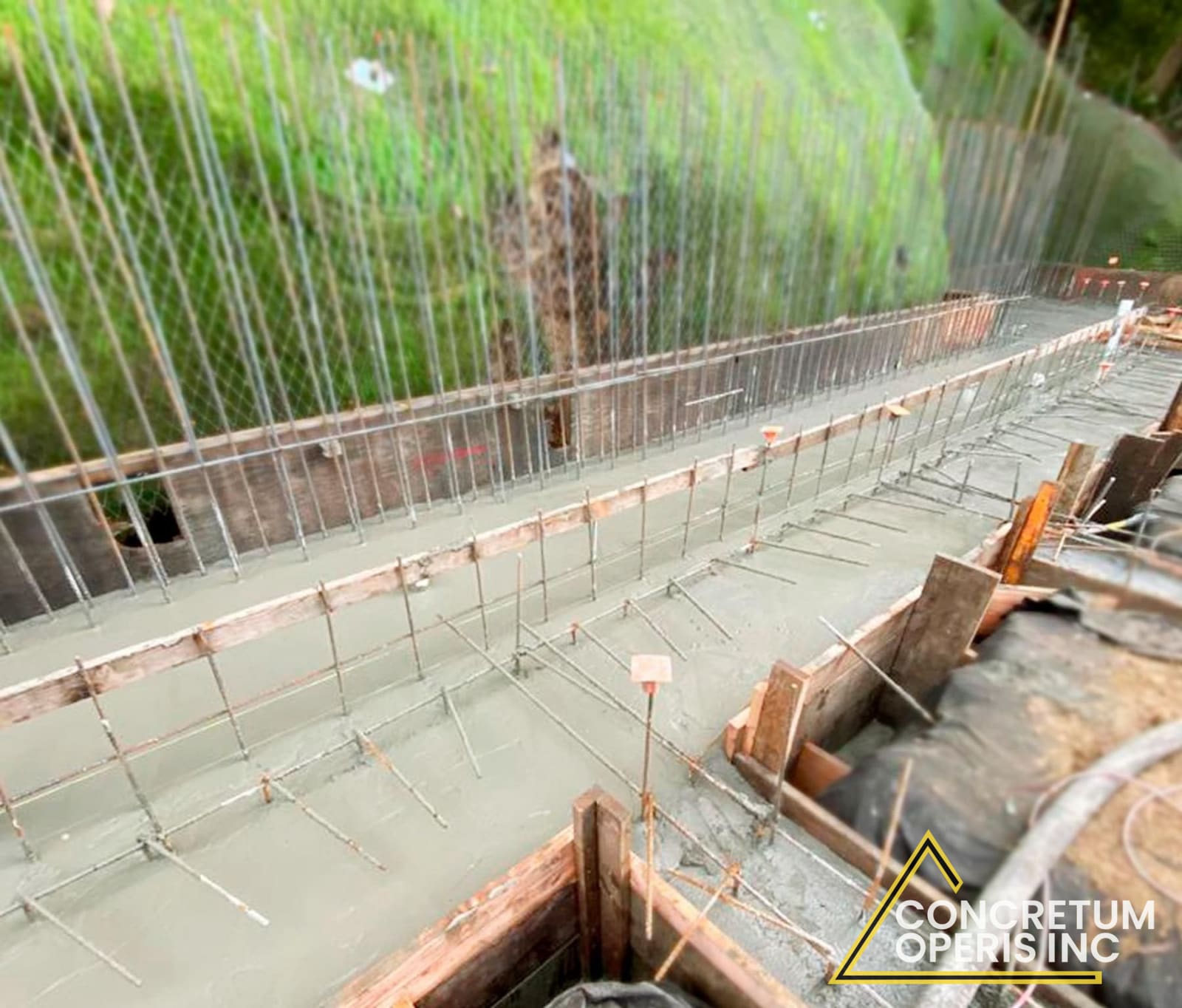 Aerial view of a rebar-reinforced foundation footing pour in Richmond, CA