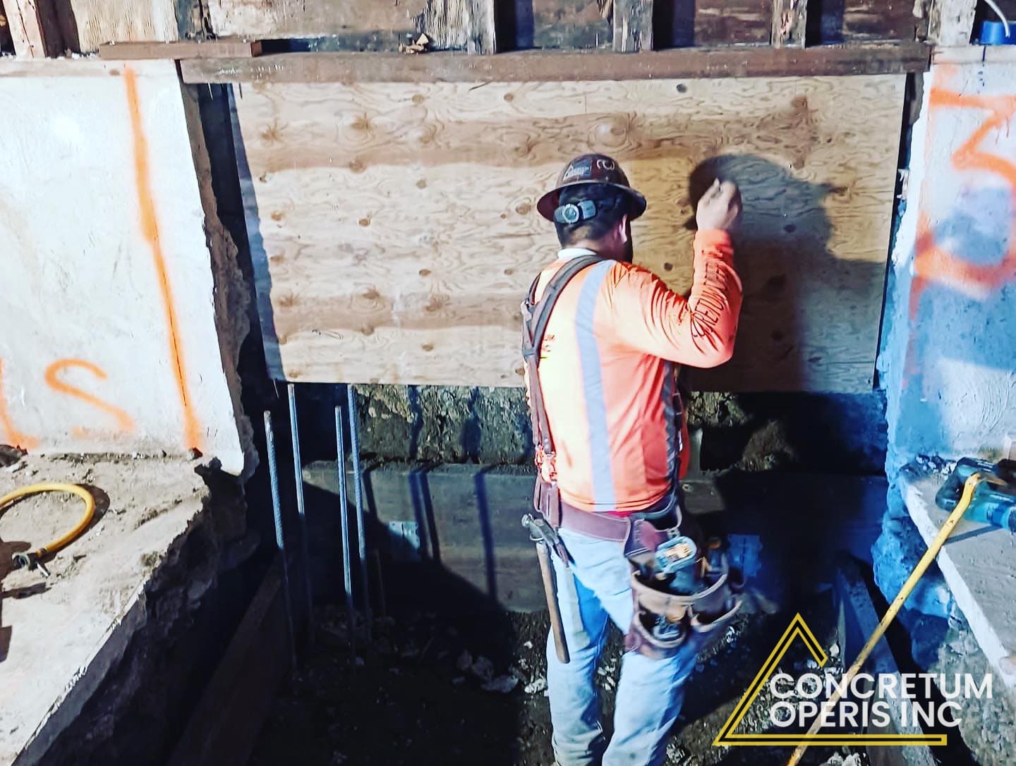 Crew installing a plywood shear panel over a cripple wall for seismic retrofit in Richmond, CA