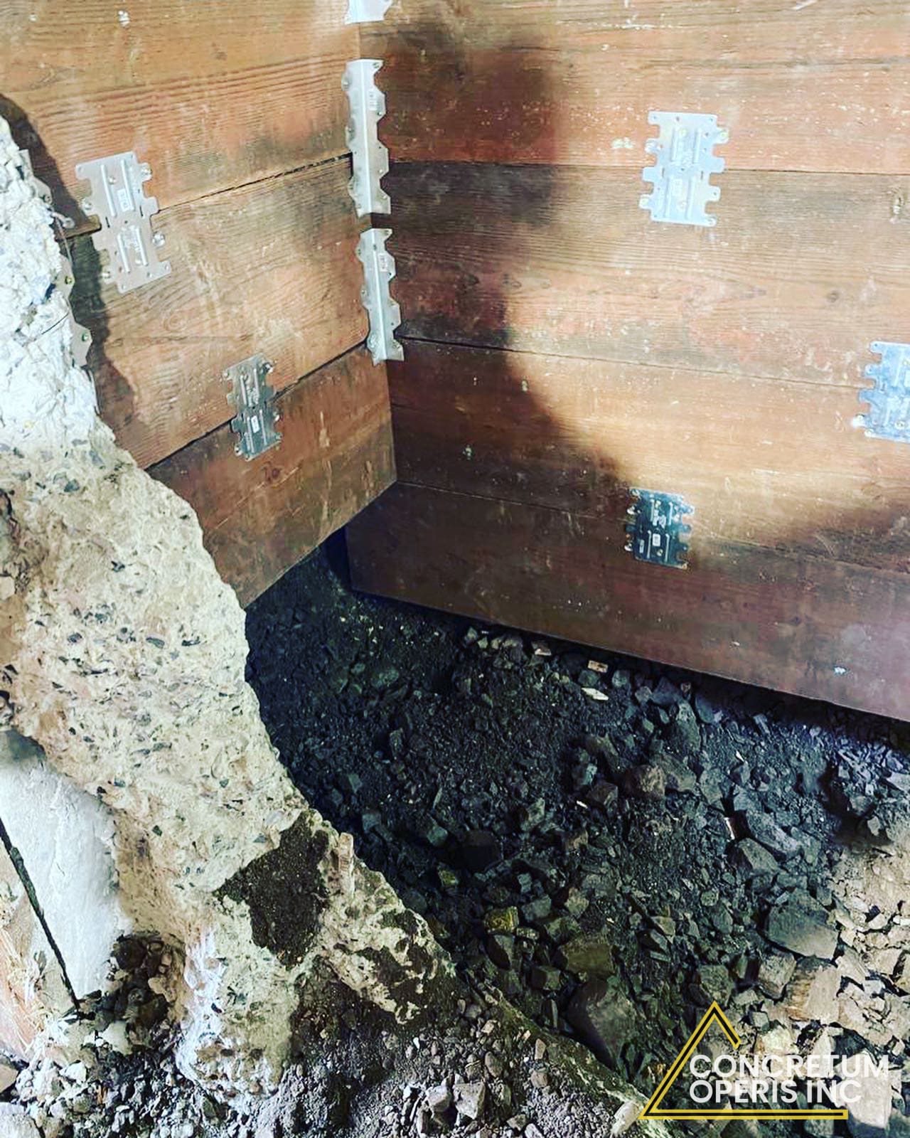 Seismic retrofit hardware and framing connectors installed along a foundation wall in Richmond, CA