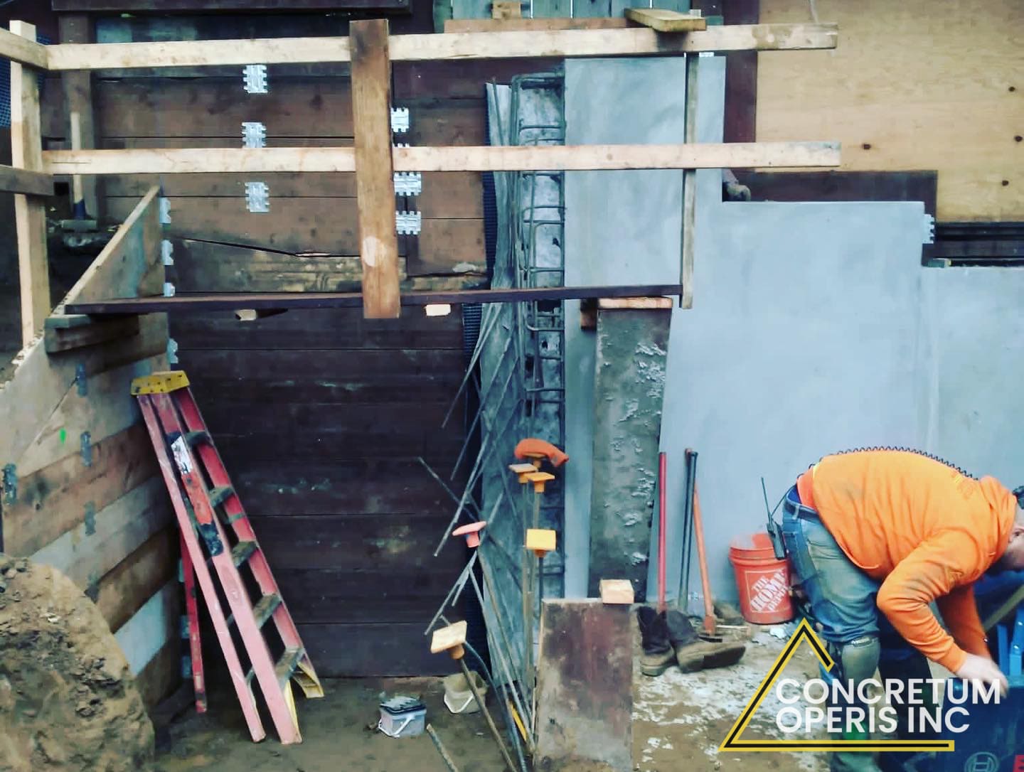 Plywood shear wall and hold-down hardware installed next to an excavated foundation pit in Richmond, CA