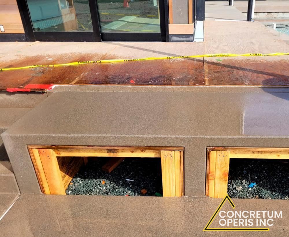 Finished concrete planter curb with drainage openings in Richmond, CA