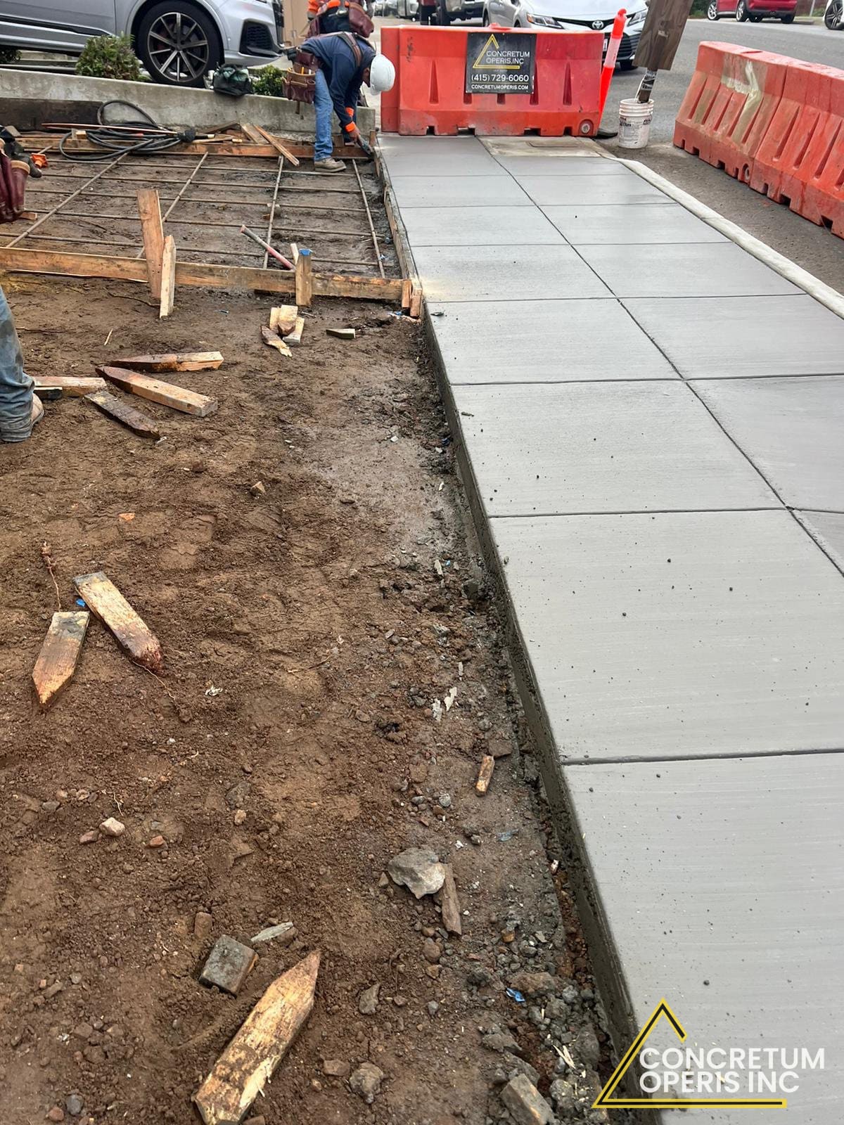 Newly poured concrete sidewalk along a residential curb in Richmond, CA