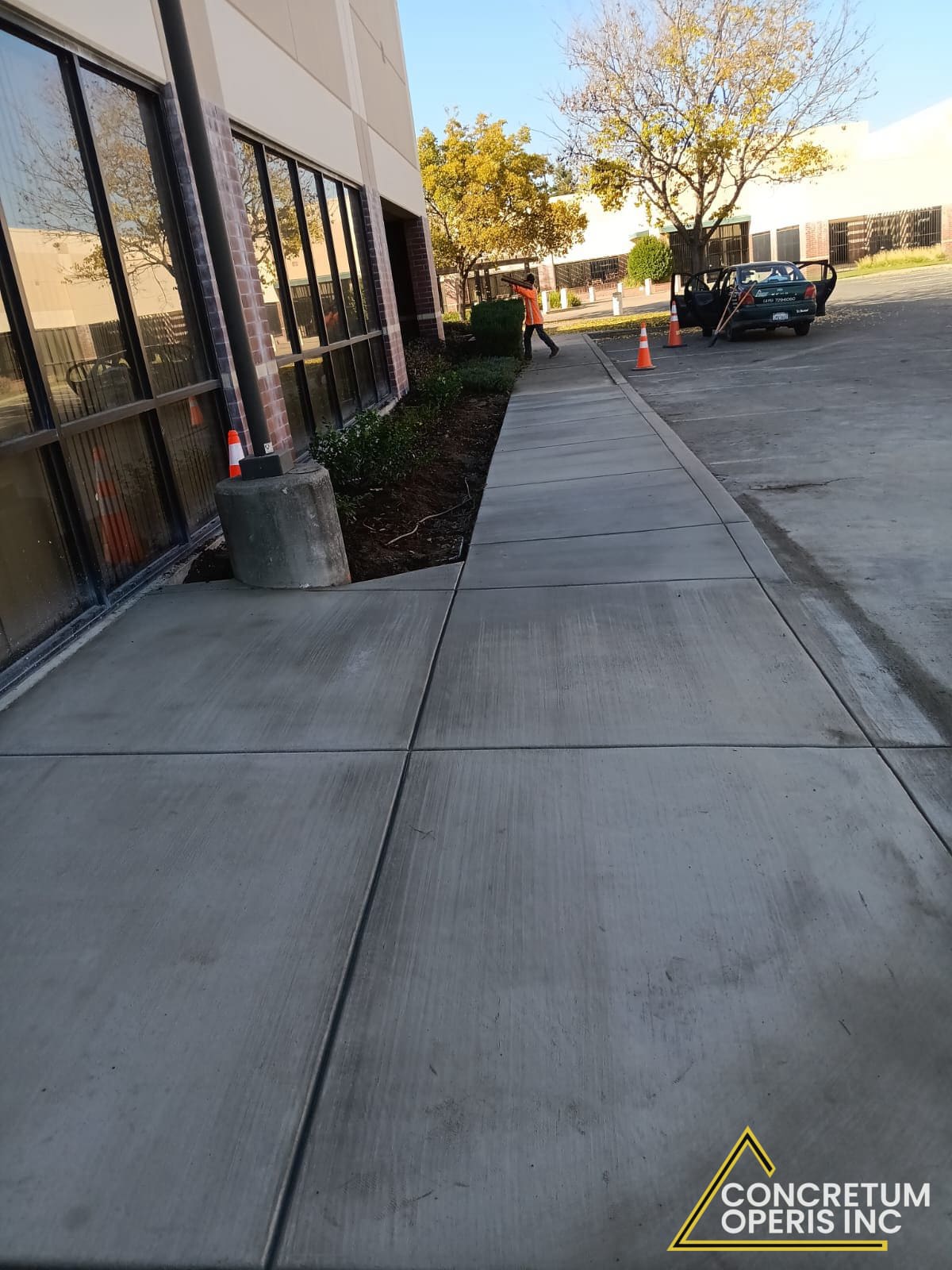 Finished concrete sidewalk along a commercial building in Richmond, CA