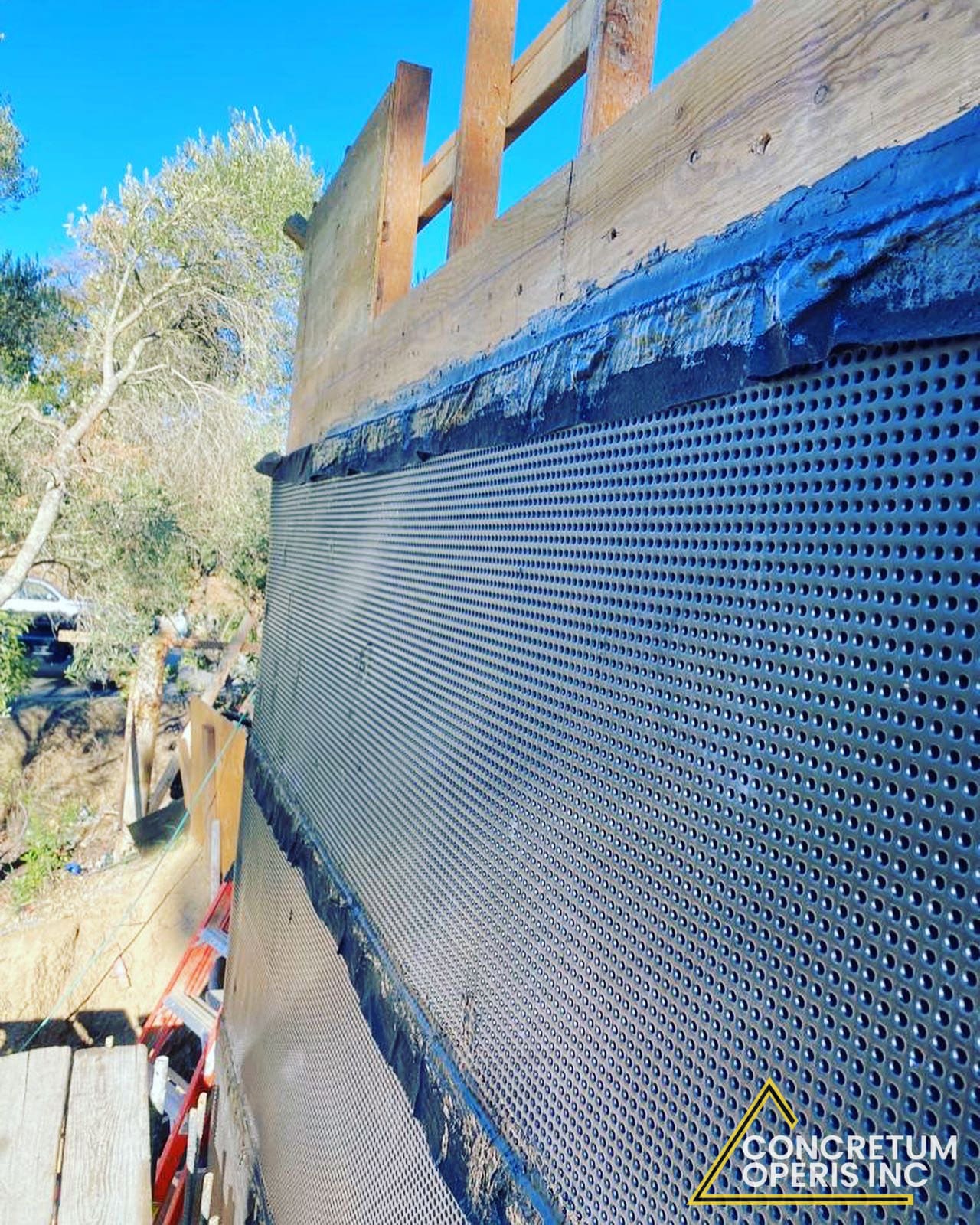 Waterproofing membrane and drainage board installed along a foundation wall in Richmond, CA